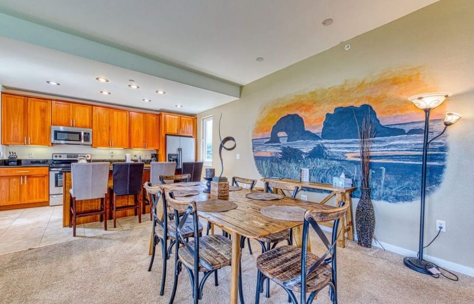Large dining table with 4 additional seating at kitchen island. 