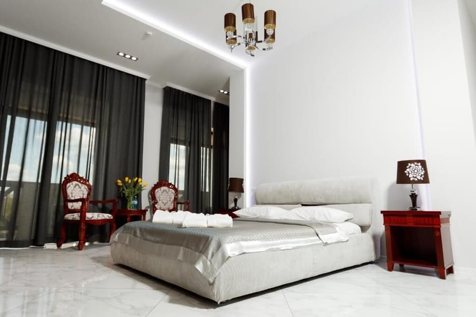 Deluxe Double Room, Balcony | In-room safe, desk, laptop workspace, blackout drapes