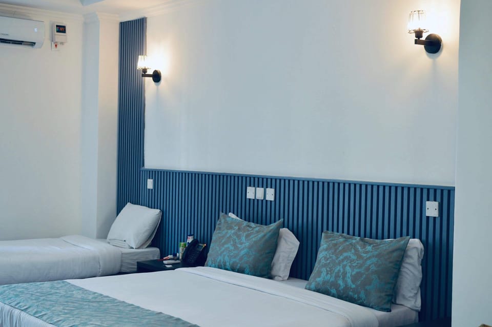 Deluxe Triple Room, Patio, City View | Free WiFi