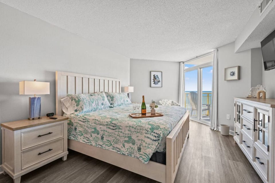 This Main Bedroom Suite is equipped with a king bed, Smart TV, direct oceanfront balcony access, and a private bathroom.  Plenty of closet, linen, and accessory storage essentials.