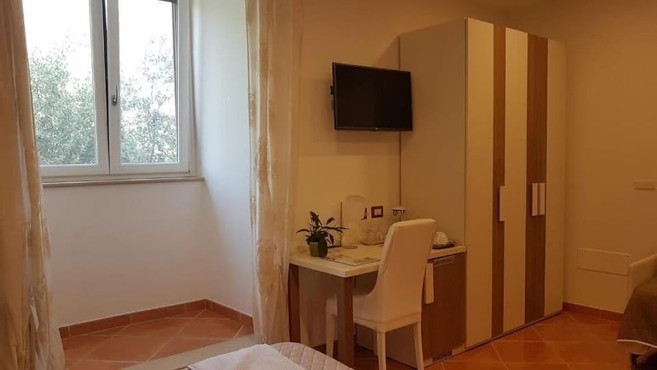 Basic Quadruple Room, Mountain View | Minibar, in-room safe, desk, laptop workspace