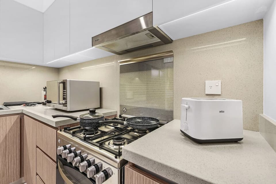 Kitchen: Culinary adventures await in this modern space with sleek appliances and stylish decor!