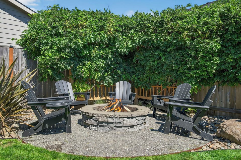 Relaxing fire pit area surrounded by beautiful wisteria