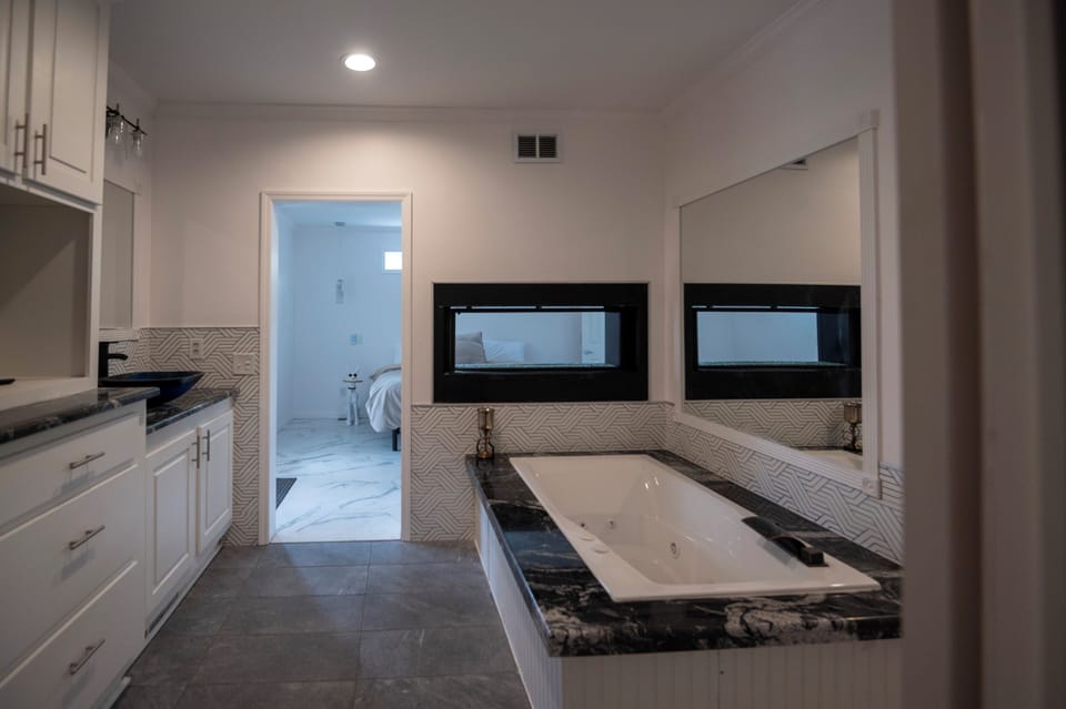 Master suit bath, jetted tub with 2 way fireplace.  