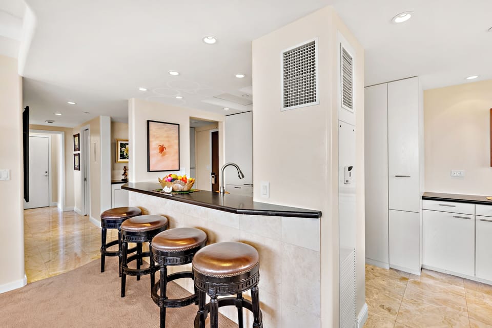 Your gourmet kitchen awaits with rich wood cabinetry, granite counters, and stainless-steel appliances. Perfect for preparing memorable meals together.
