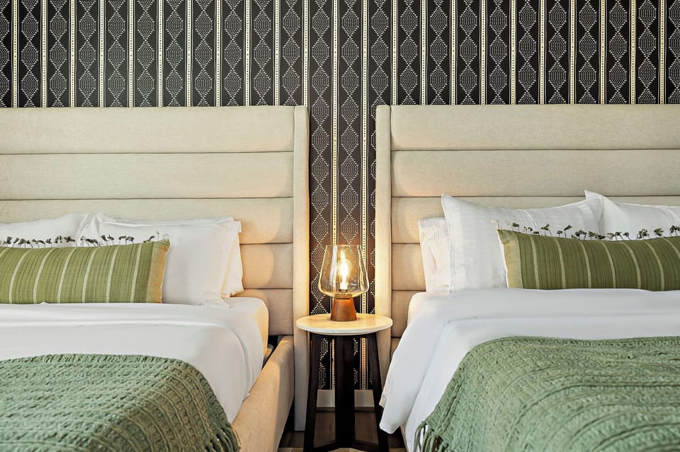 The room is designed with a calming color palette and soft lighting, creating a peaceful and inviting atmosphere.