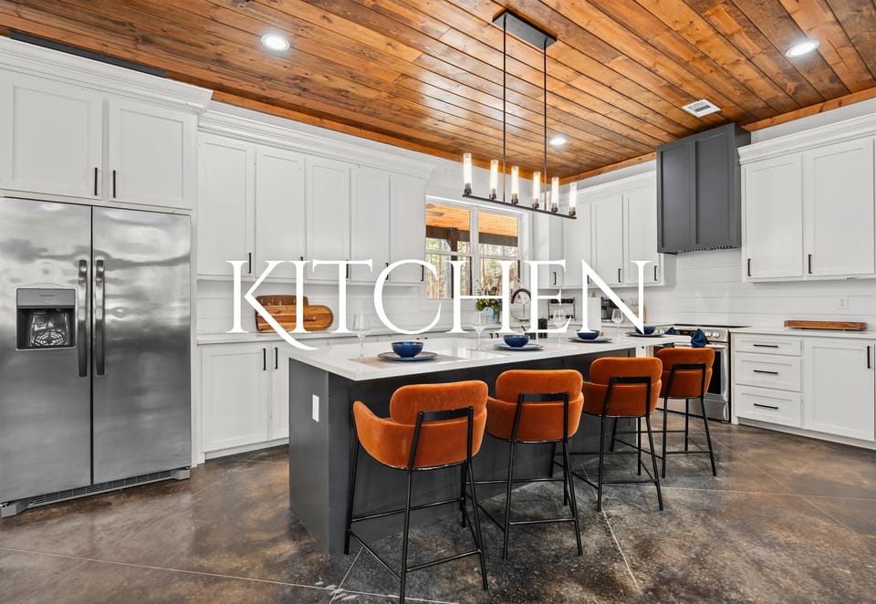 This beautifully designed kitchen offers top-of-the-line appliances, plenty of counter space, and an oversized island perfect for meal prep or casual dining.