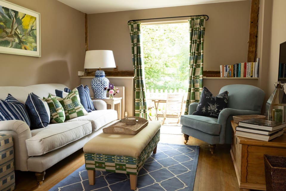 The comfy sitting room with a Smart television and access to the garden