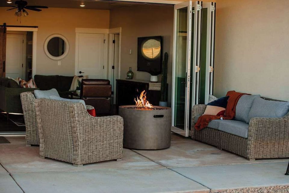 Sit back and relax at Desert Sunrise in Kanab, Utah.  This home has a full glass wall that opens up to a spacious outdoor seating area with private fire pit.  