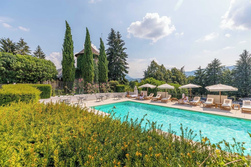 Lounge by the pool in the sunshine.