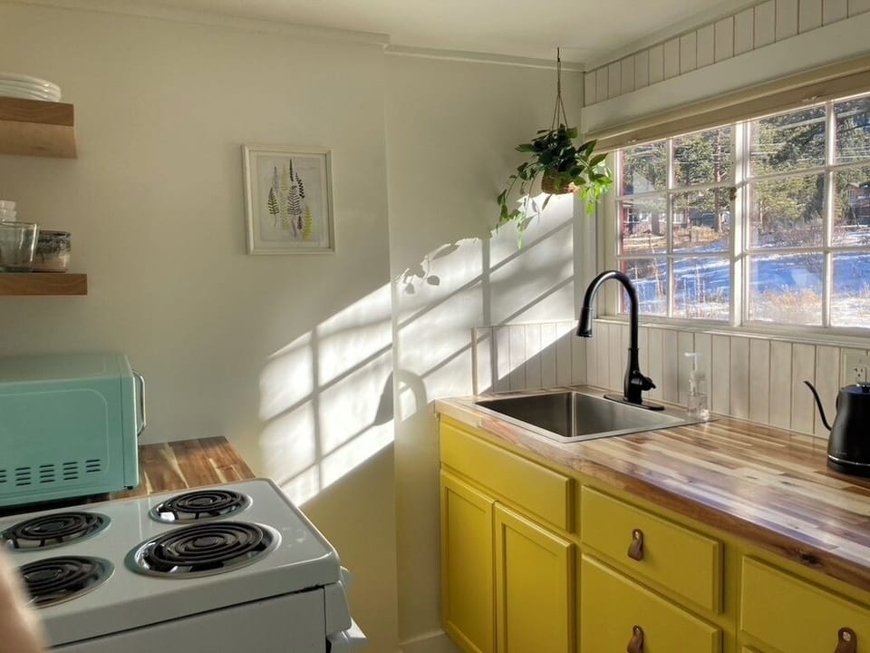 cheerful kitchen with all you need to get your day started & relax at night