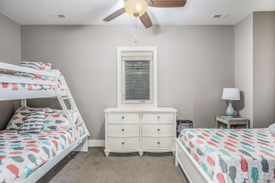 Kids Bunk Room. 1 bunk bed with twin over double orientation and 1 twin bed. 
