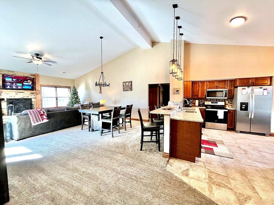 Spacious open-concept living area seamlessly connecting the kitchen, dining, and living spaces