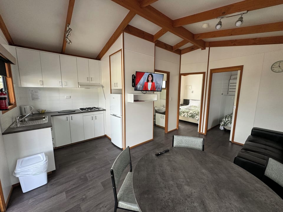 Deluxe Cabin | Living area | Flat-screen TV