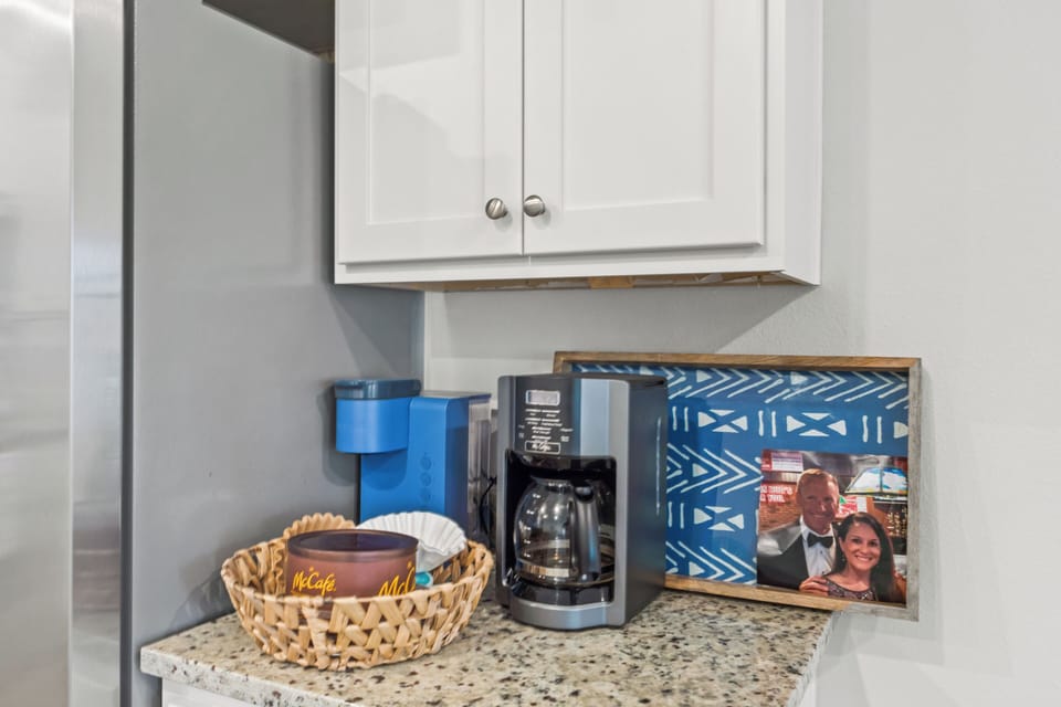 Start your mornings with fresh coffee from your private kitchen's built-in coffee station, complete with all the essentials for your perfect brew.