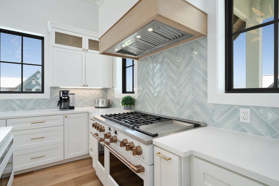 A 48" GE Cafe gas range with dual ovens will get the job done for large groups!