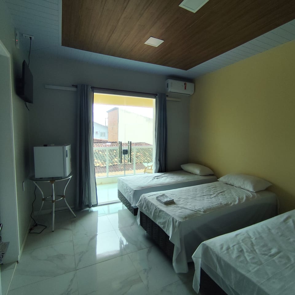 Comfort Triple Room, Courtyard View | Laptop workspace, free WiFi