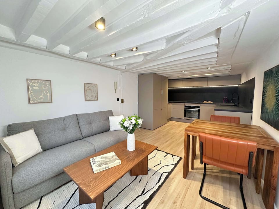 Enjoy a stylish living room with a cozy dining area, a relaxing corner.