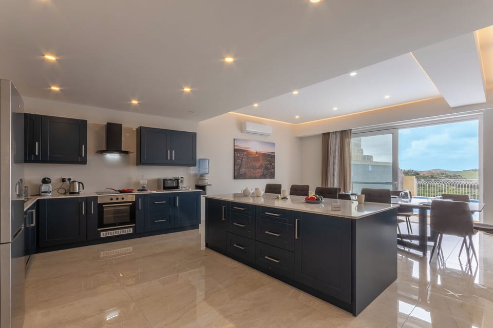Family Villa, Multiple Bedrooms (Magnifica Gozitan Villa Pool And) | Private kitchen | Fridge, microwave, oven, stovetop