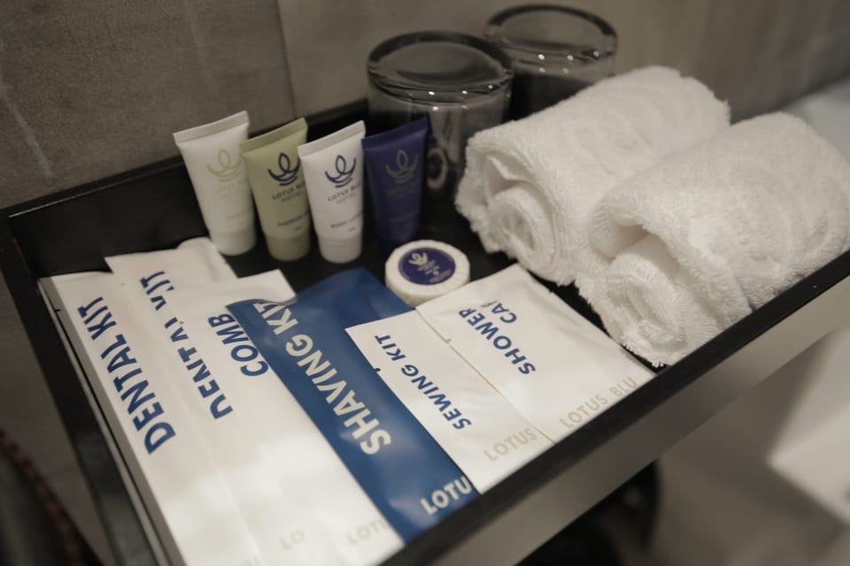 Suite | Bathroom | Shower, hair dryer, slippers, towels