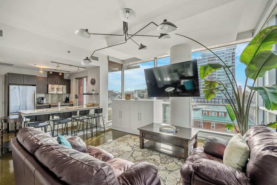 Open-concept living area flowing into the kitchen and dining space.