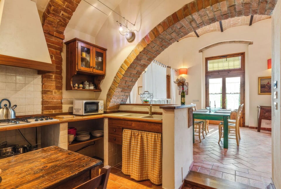 Furniture, Interior Design, Wall, Flooring, Wood, Kitchen, Ceiling, Countertop, Chair, Table