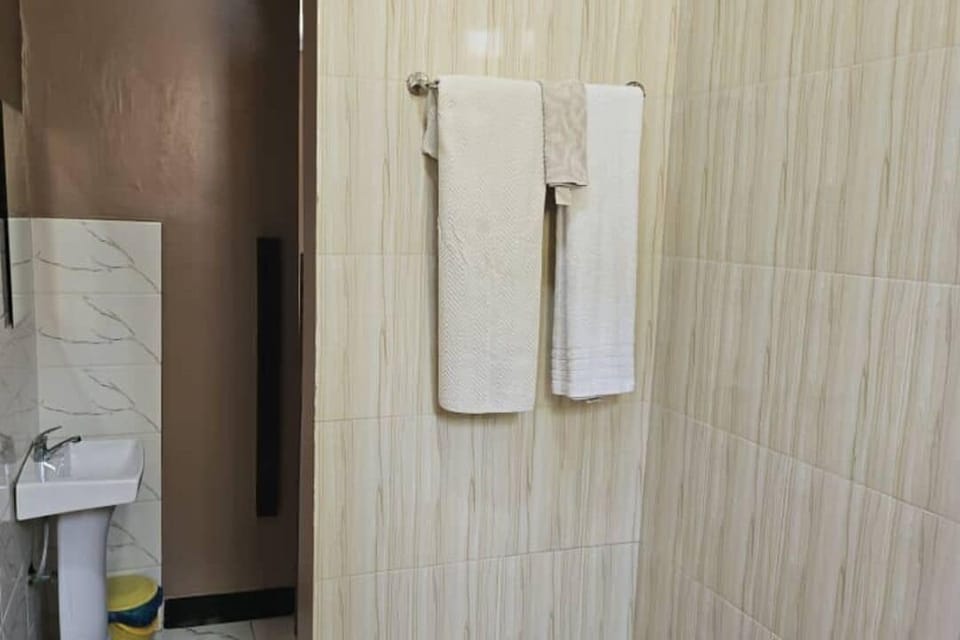 Shower, bathrobes, slippers, soap