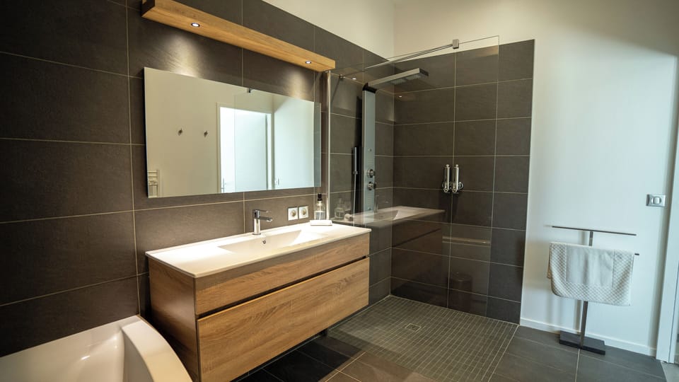 Family Apartment, Garden View | Bathroom | Shower, hair dryer, towels, soap