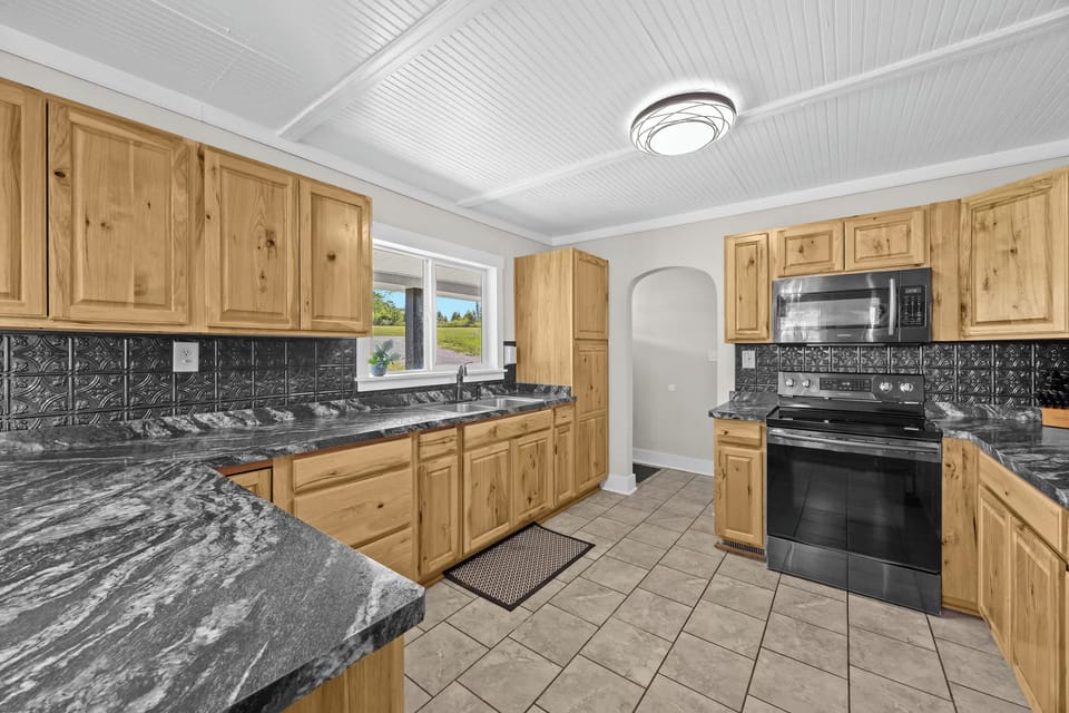 Kitchen: Ready for your morning coffee and more! Our spacious kitchen has everything you need.