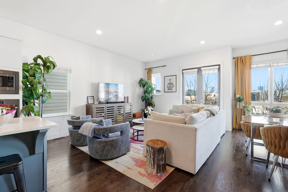 Spacious living for gathering & relaxing — 55" Smart TV + games 🎉