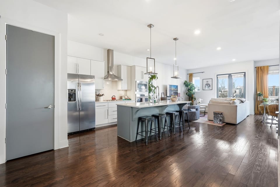 Fully stocked modern kitchen with stainless steel appliances