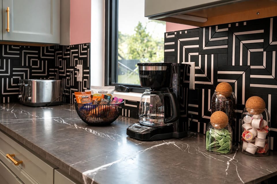 Stocked coffee bar with local beans, creamers, tea, and sugars (+ a snack basket for all guests :) 