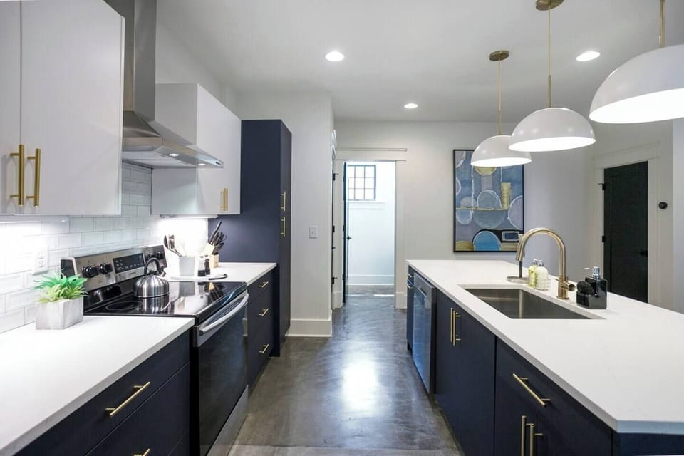 Kitchen fully stocked with essential cookware.
