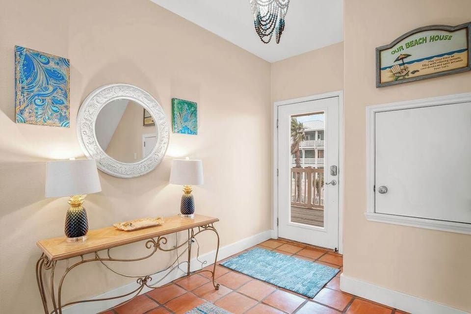 Step into coastal comfort the moment you arrive! Our inviting entryway sets the tone for a relaxing beachside getaway—bright, airy, and designed for a warm welcome. 
