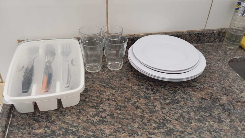 Basic Apartment, City View | Private kitchen | Mini-fridge, microwave, cookware/dishes/utensils, dining tables