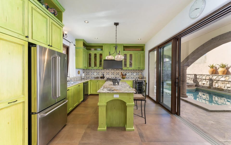 Modern kitchen with professional stove, wine fridge and up-to-date appliances