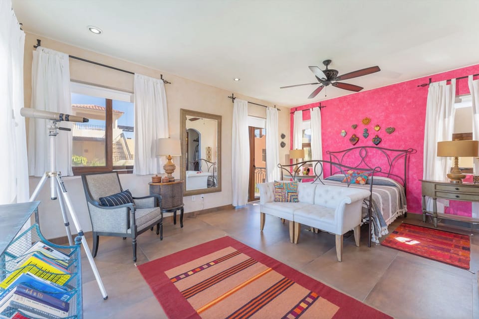 Master bedroom with Queen bed, small patio and Sea of Cortez view