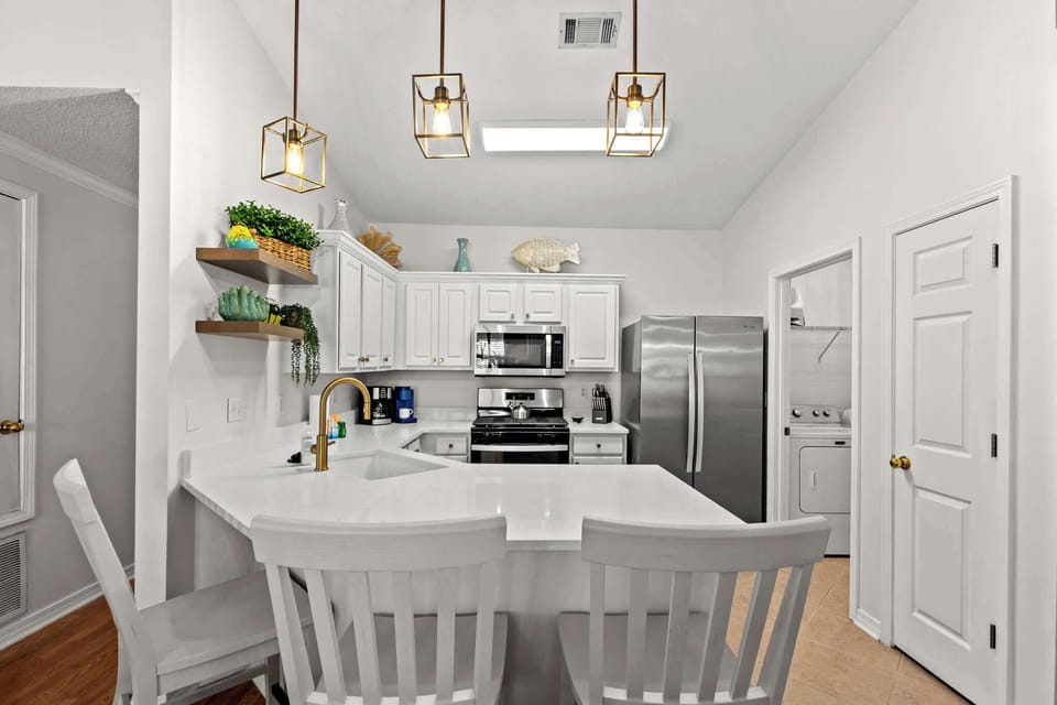 Our breakfast bar completes the kitchen space, with kitchen stools to enjoy a light meal or an after the pool snack!
