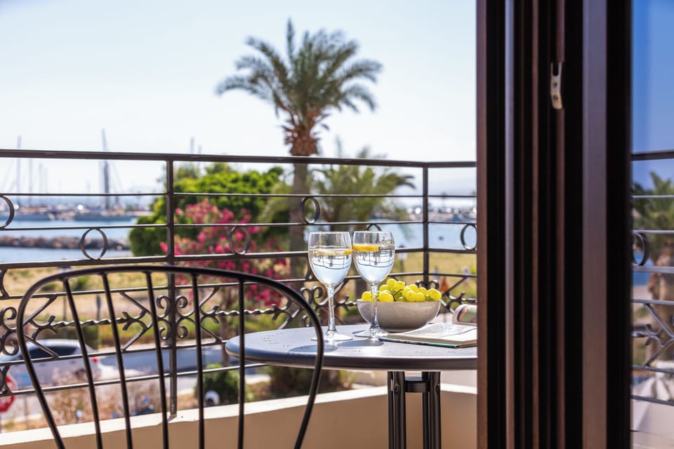 There is a balcony with a table and chairs where you can enjoy the view.