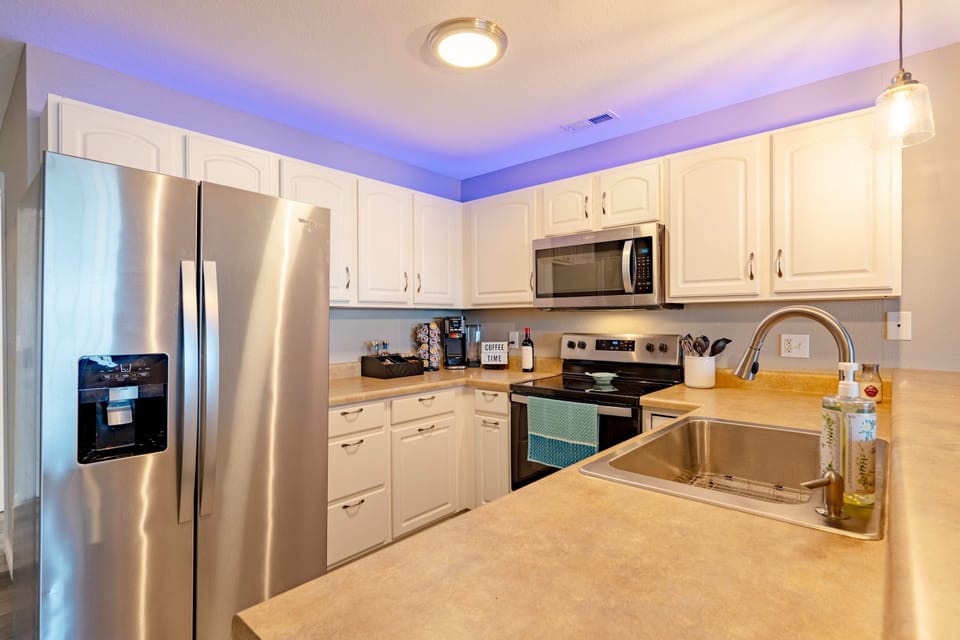The open, airy kitchen offers ample space & every home comfort