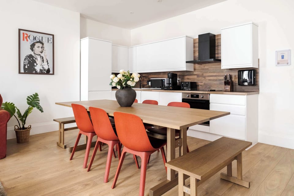 Full Kitchen | Treat yourself to a fully-equipped kitchen, ideal for any duration of stay. Revel in modern amenities such as a washer, dryer, dishwasher, espresso machine, and a fresh water dispenser.