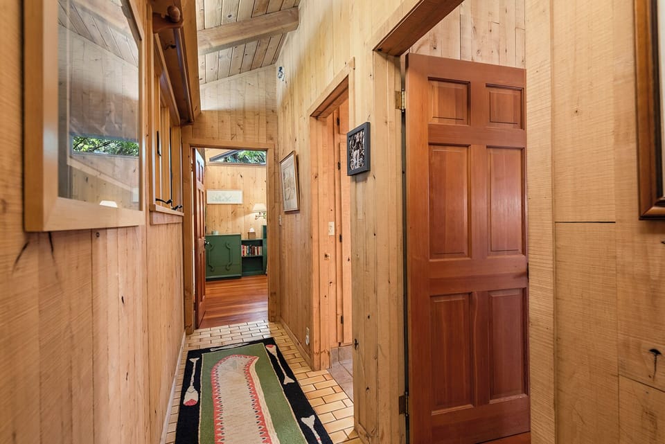The downstairs hallway leads the bedroom, study and a full bathroom.