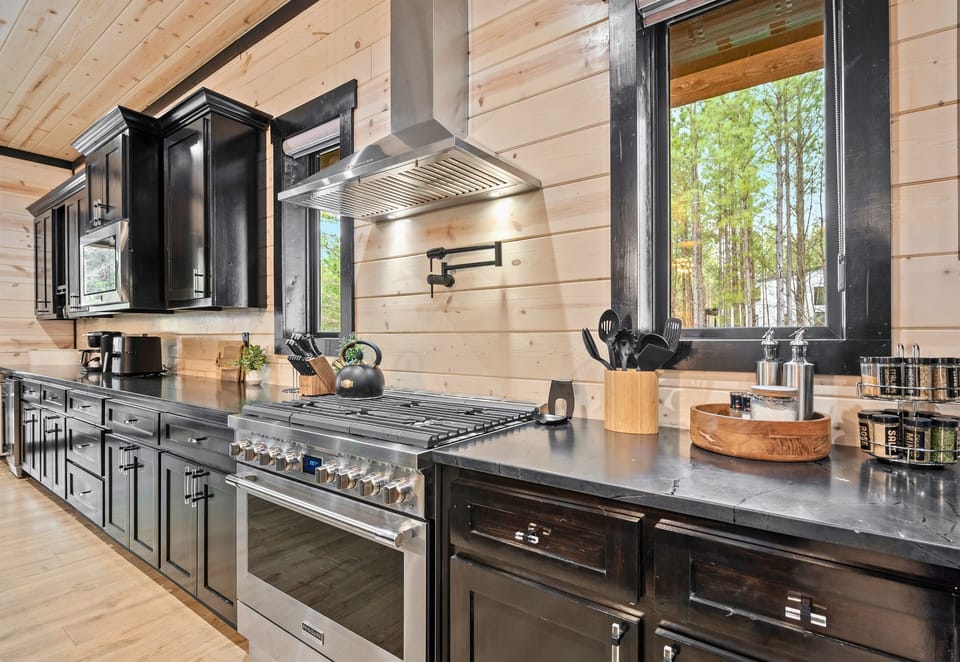A chef’s dream with high-end finishes, a gas range, and plenty of prep space, this kitchen ensures that every meal feels like an experience rather than a task.