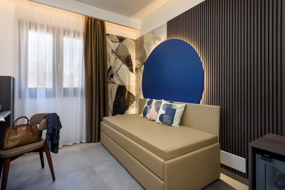Deluxe Quadruple Room, Valley View | Minibar, in-room safe, desk, laptop workspace