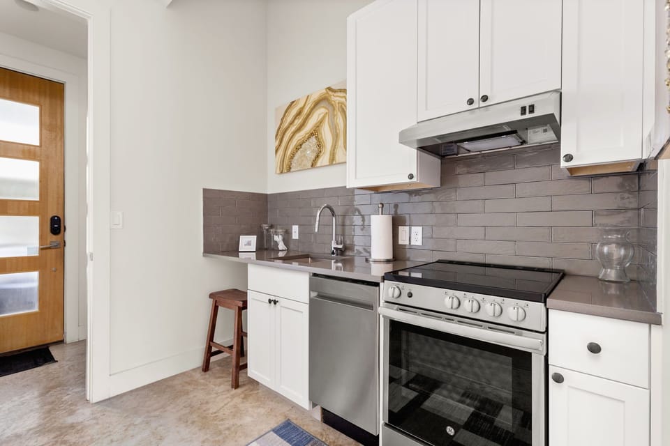 Fully stocked kitchen with both a drip and k-cup coffee maker. 
