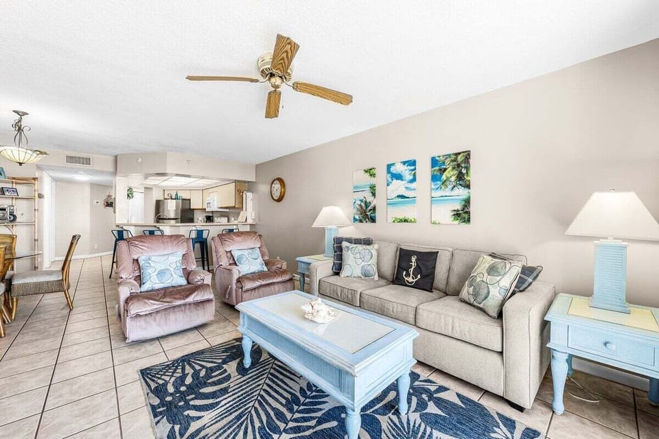 The cozy living room offers a comfortable sofa bed and a TV, perfect for relaxing or hosting guests.