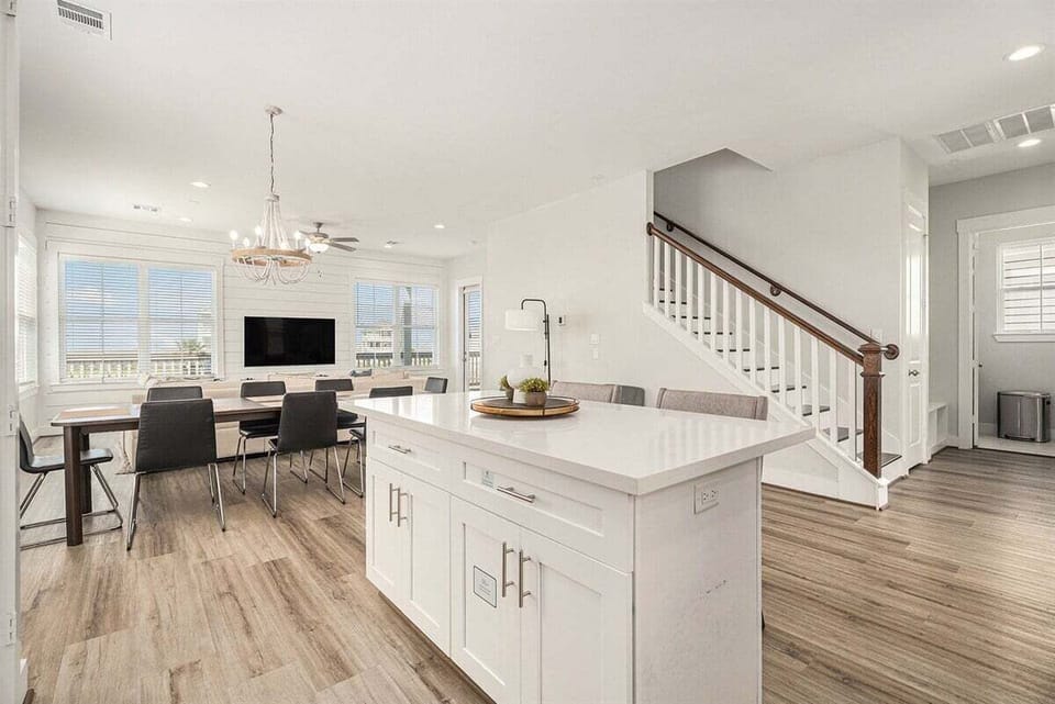 Wide interior view showcasing open living space and modern coastal design—perfect for entertaining guests.