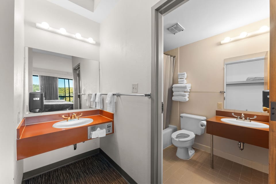 Modern and functional bathroom with a spacious vanity, ensuring convenience and comfort for your stay.