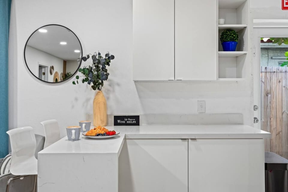 Whip up your favorite meals in this charming  kitchen, designed with modern touches.