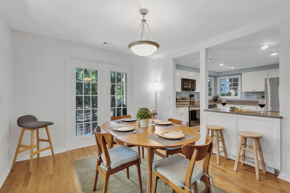 Dining table with seating for 4, plus at the kitchen island to savor your meals together.
